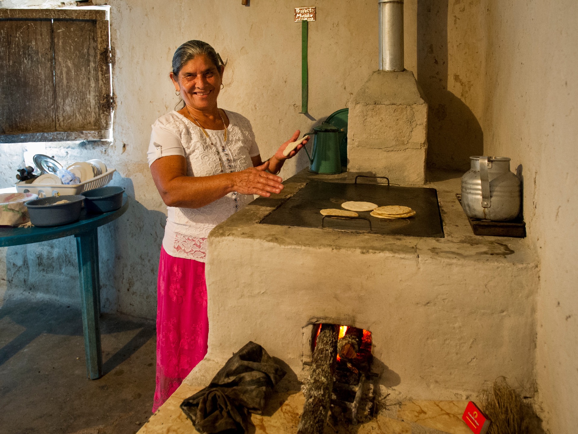 A woman makes tortillas with her new cookstove in Honduras.