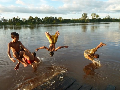 Children jump into the river in Katingan Peatlands and Forest in Indonesia.