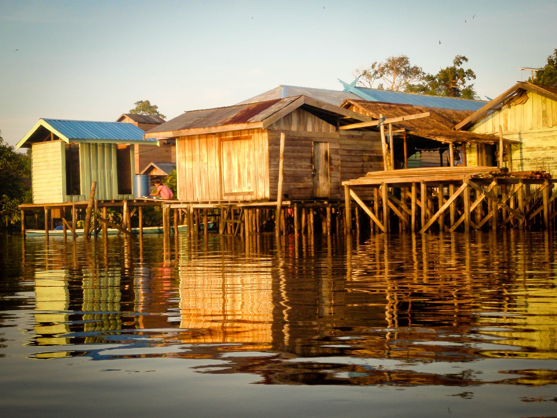 A river village at sunset in Katingan Peatlands and Forest in Indonesia.